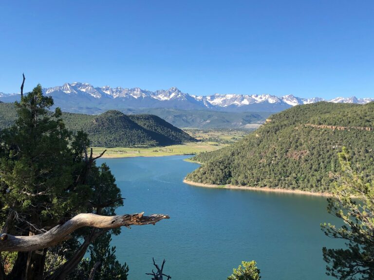 Large blue lake surrounded by mountains.